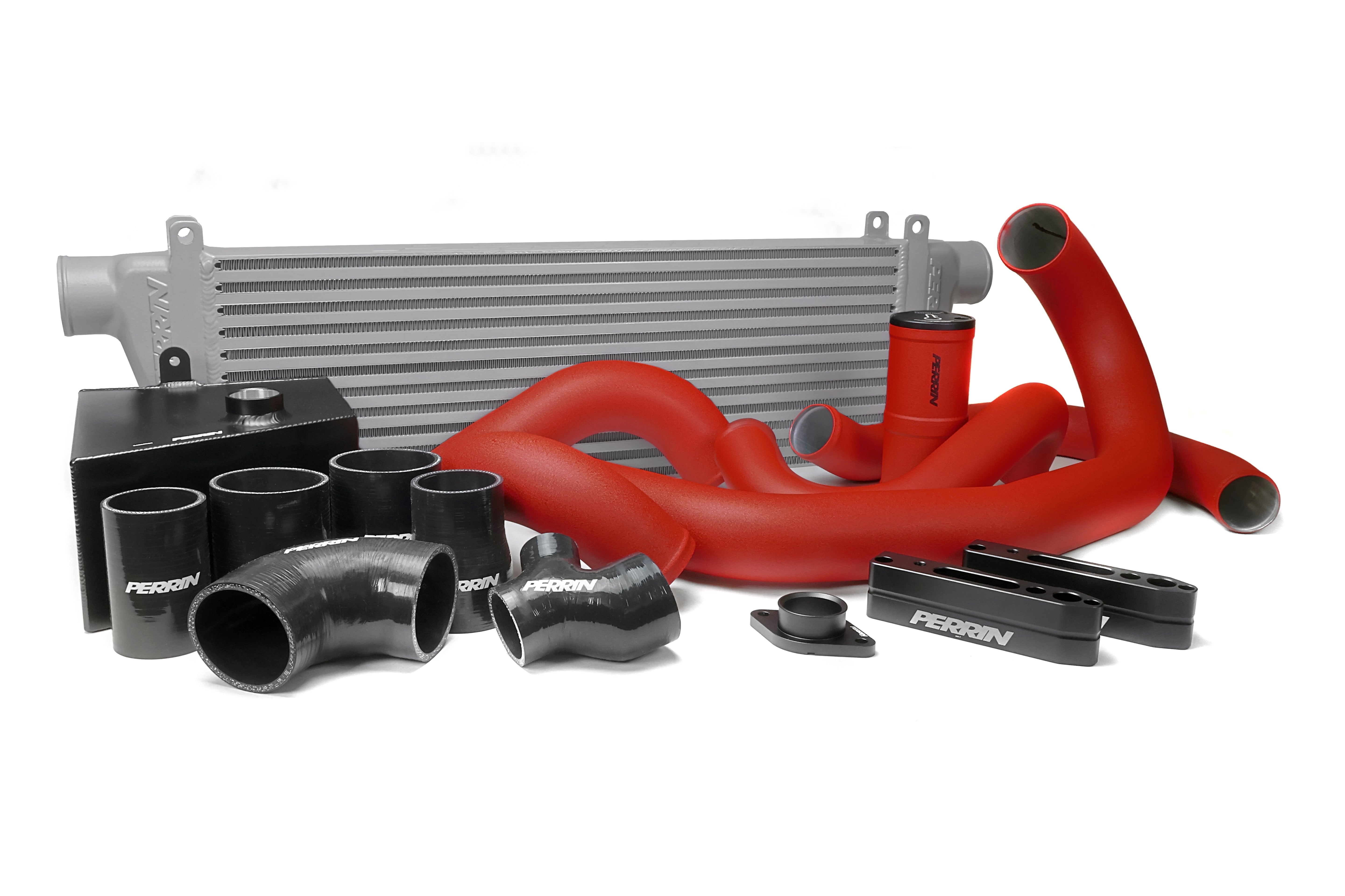 Front mount intercooler kit for 2015-2021 WRX featuring red silicone hoses and black aluminum components.