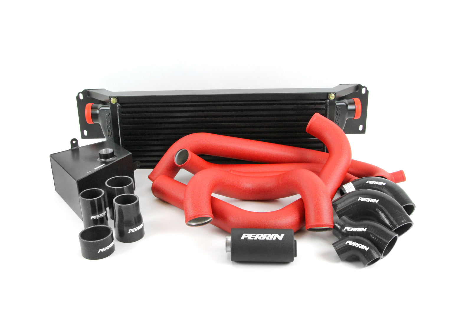 Front mount intercooler kit for 2015-2021 Subaru STI, featuring red silicone hoses and aluminum components for enhanced performance.