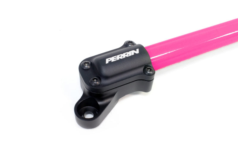 Perrin strut brace for BRZ/FR-S/86/GR86 featuring a pink bar and black mounting hardware for enhanced vehicle stability.