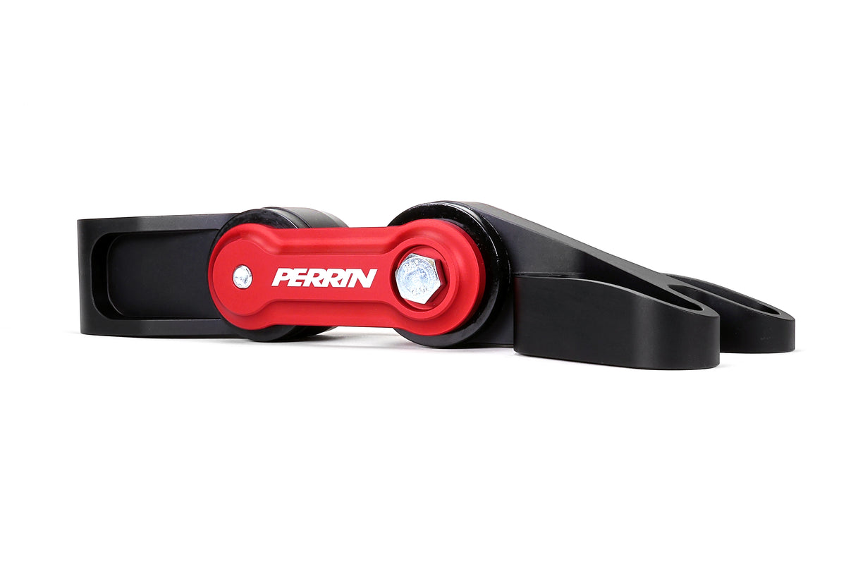 PERRIN Pitch Stop Mount for GR Corolla in black and red, angled view of PERRIN logo, bushings, and forked end