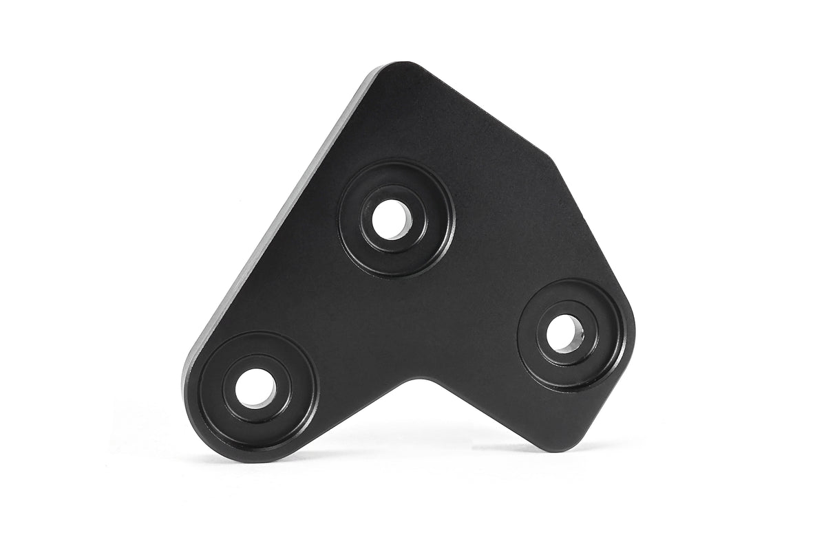 PERRIN GR Corolla Shifter Cable Bracket Lockdown with a black anodized finish on a white background.
