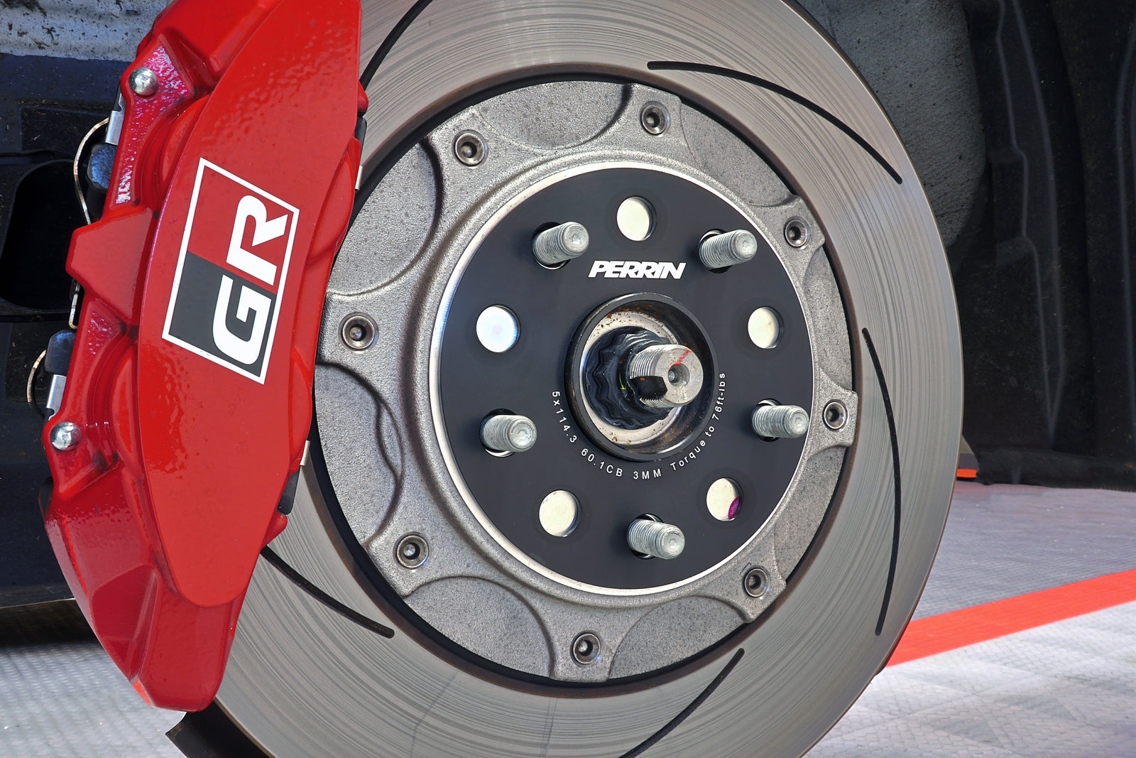 A set of PERRIN 3mm Wheel Spacers installed on a 2023-2026 Toyota GR Corolla.