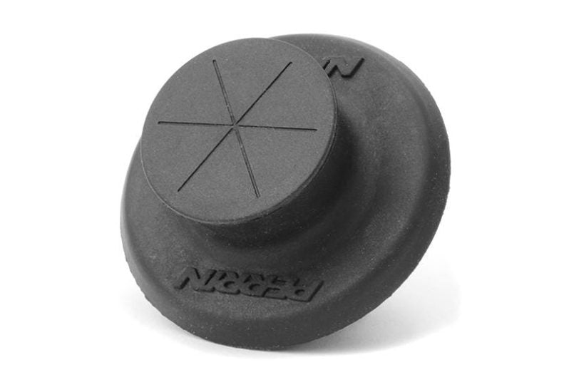Black rubber firewall grommet with a raised center and cross pattern, designed for sealing and protection in automotive applications.