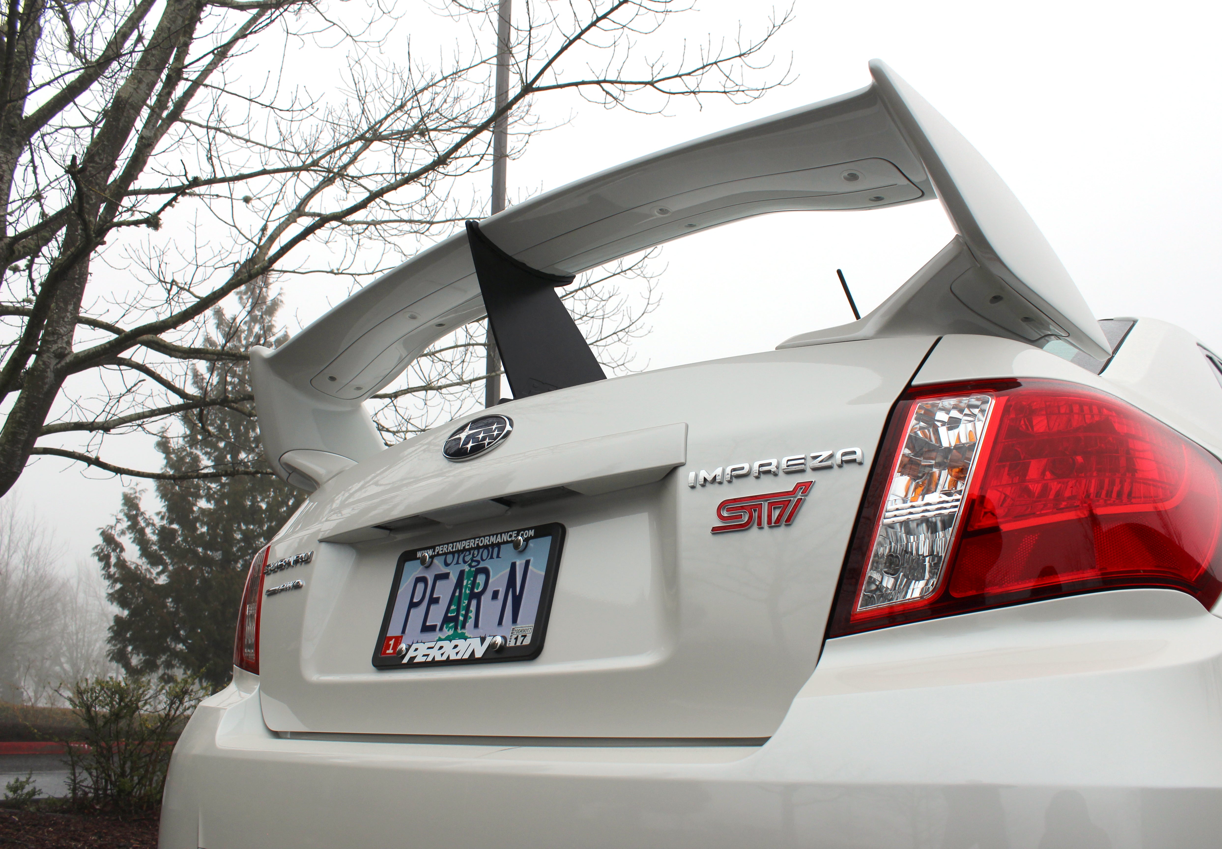 Wing stabilizer for 2011-2014 STI Sedan enhances aerodynamics and stability for performance driving.