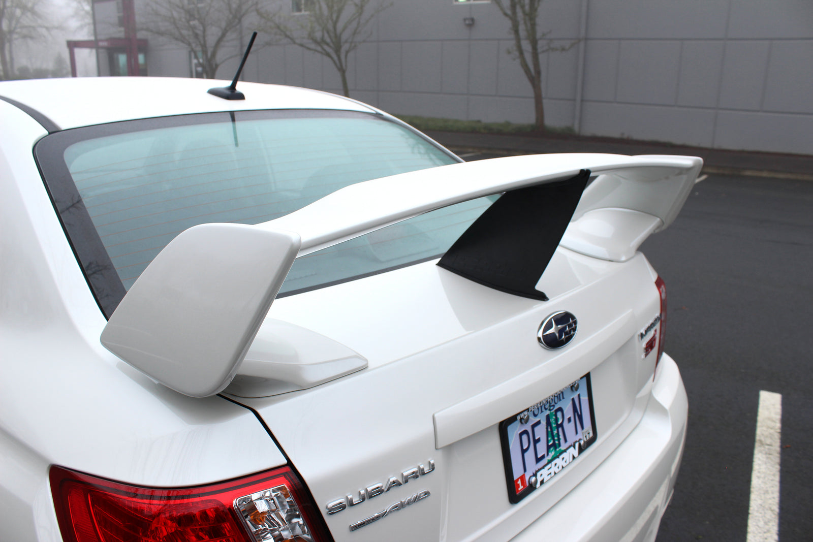 Wing stabilizer for 2011-2014 STI Sedan enhances aerodynamics and performance for Subaru enthusiasts.