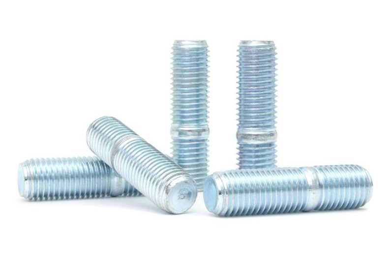 Set of metal exhaust turbo up-pipe studs, featuring a shiny, threaded surface for secure installation.