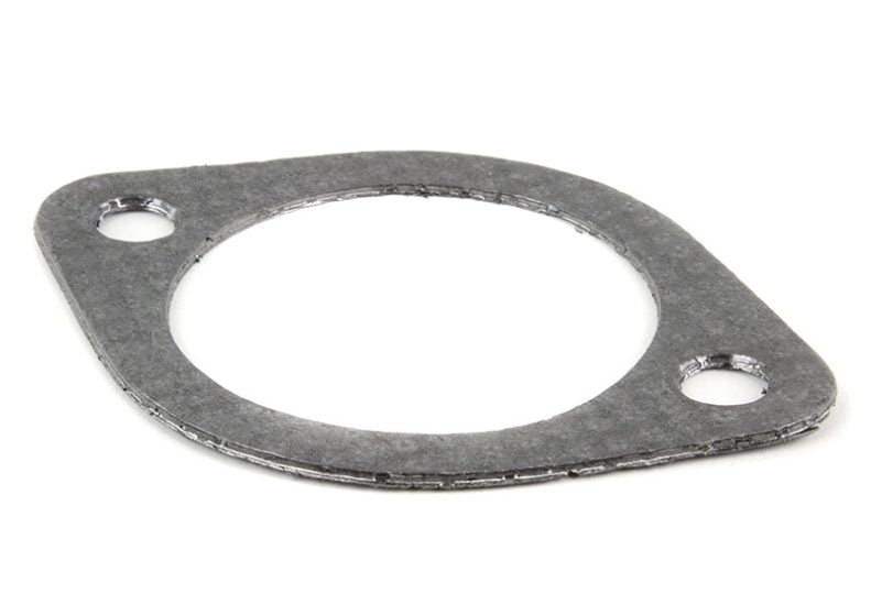 Exhaust gasket made of metal, featuring a circular shape with two mounting holes for secure installation.